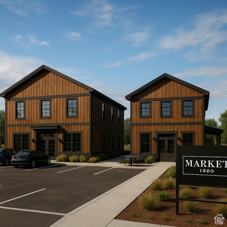 View of property with uncovered parking