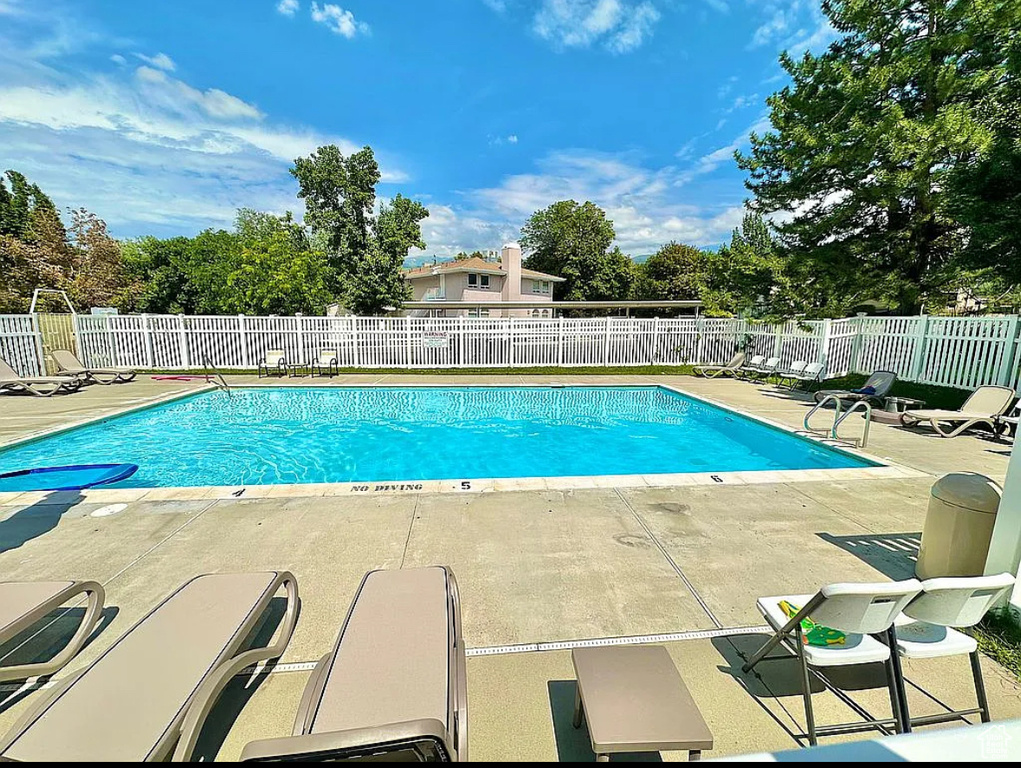 Community pool with a patio area