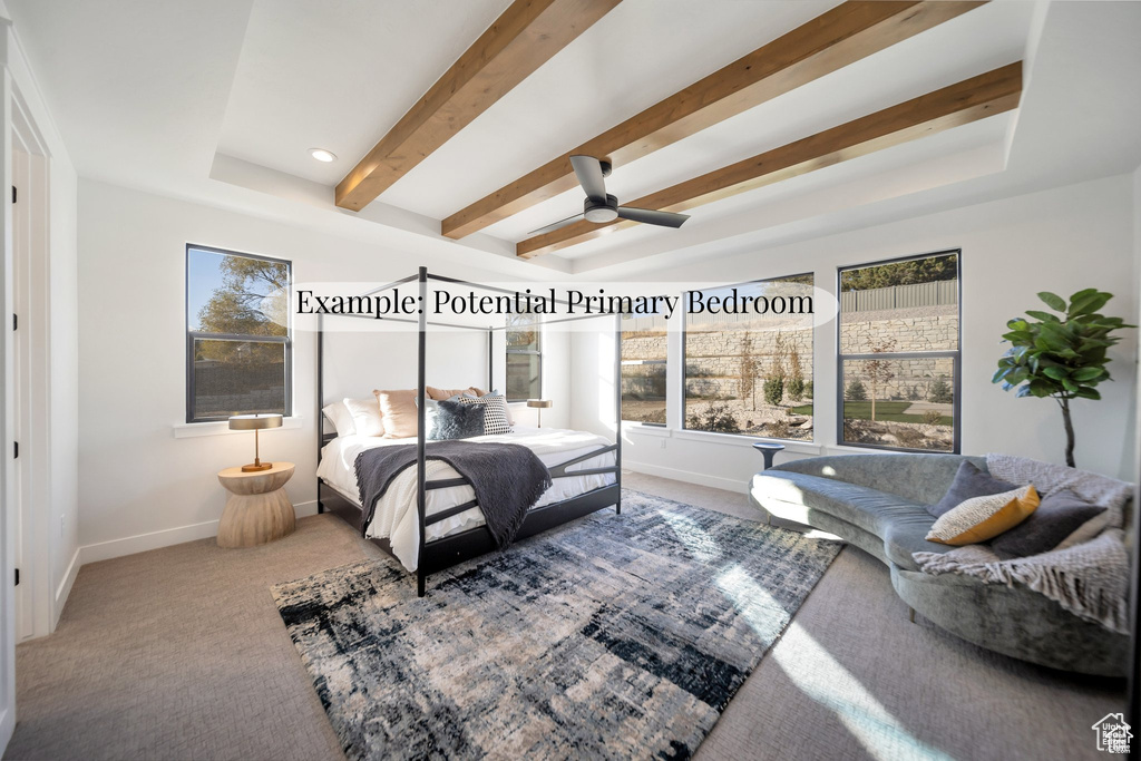 Carpeted bedroom featuring beam ceiling and a ceiling fan
