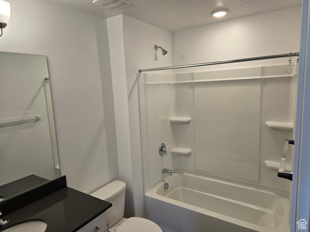 Full bath featuring shower / bathtub combination and vanity