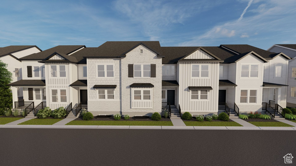 View of property with board and batten siding and a residential view