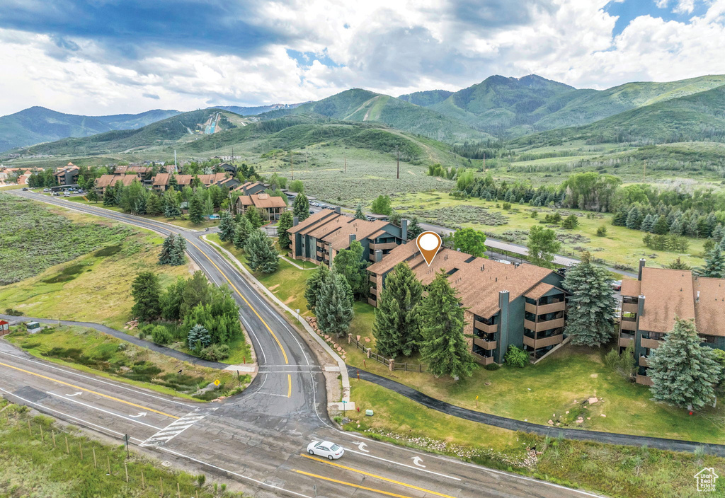 Aerial view of property's location with a mountain backdrop