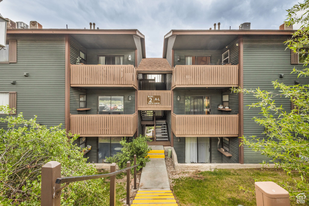 View of property featuring stairway