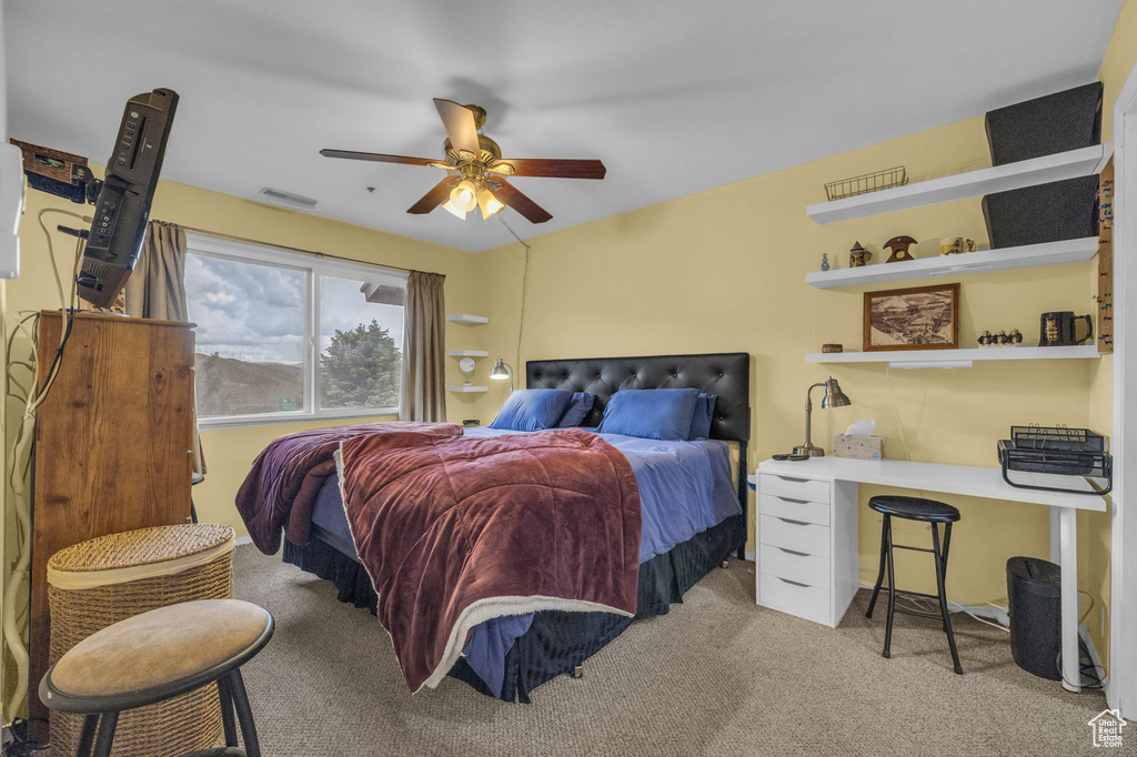 Bedroom featuring carpet flooring and a ceiling fan