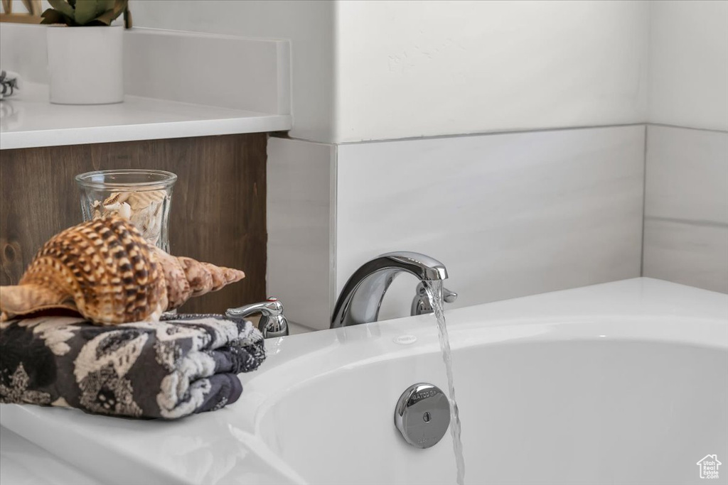 Bathroom view of a sink and a tub to relax in