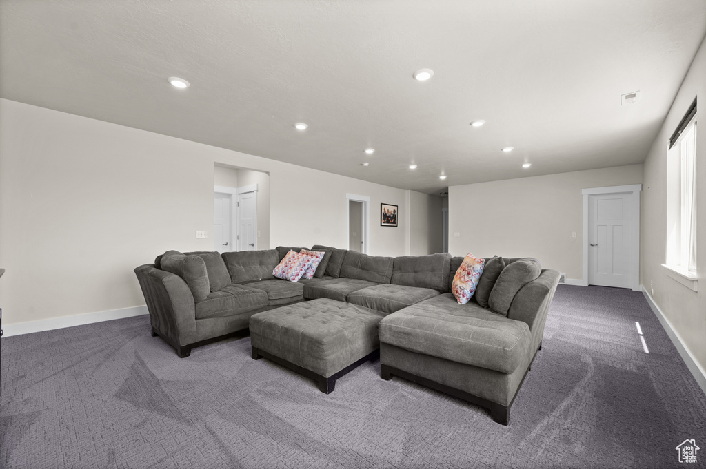 Living area featuring carpet floors and recessed lighting