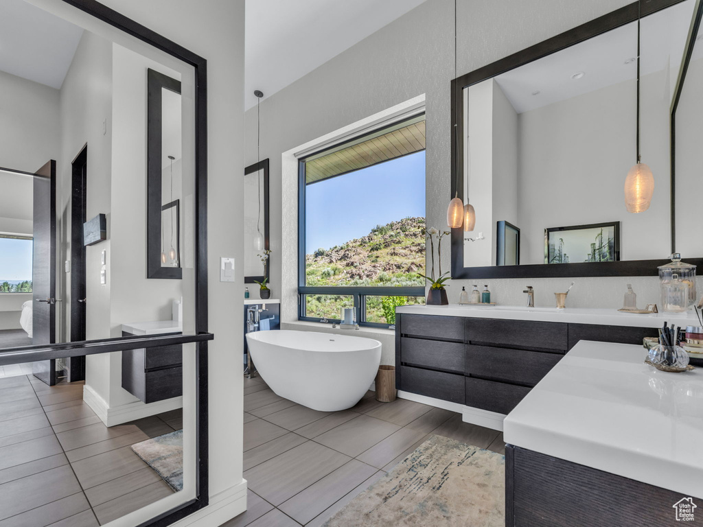 Bathroom with vanity and a freestanding bath