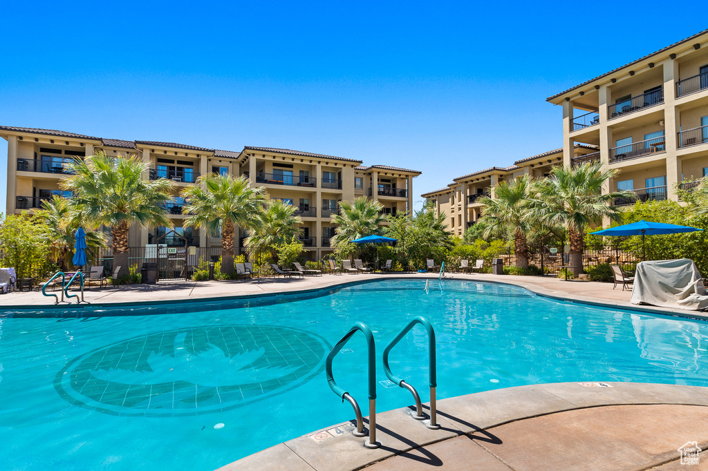 Community pool featuring area for grilling