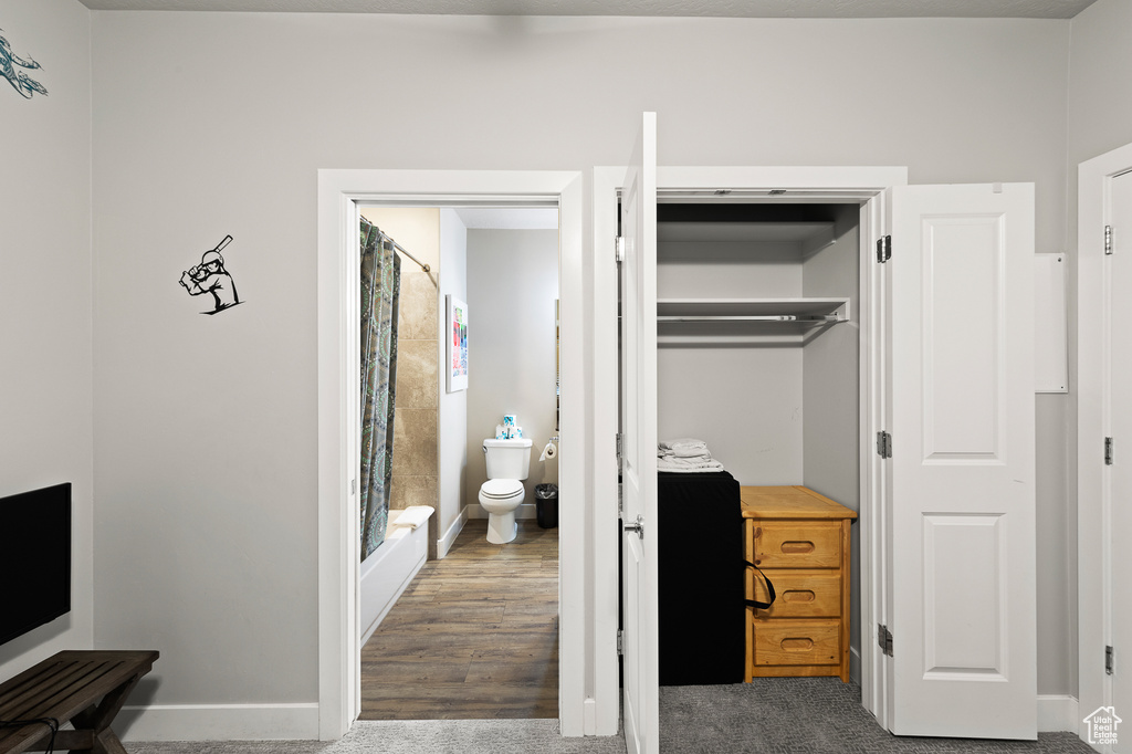 Bedroom with a closet and baseboards