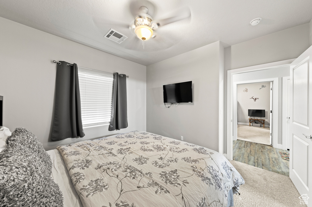 Bedroom featuring a ceiling fan and carpet flooring