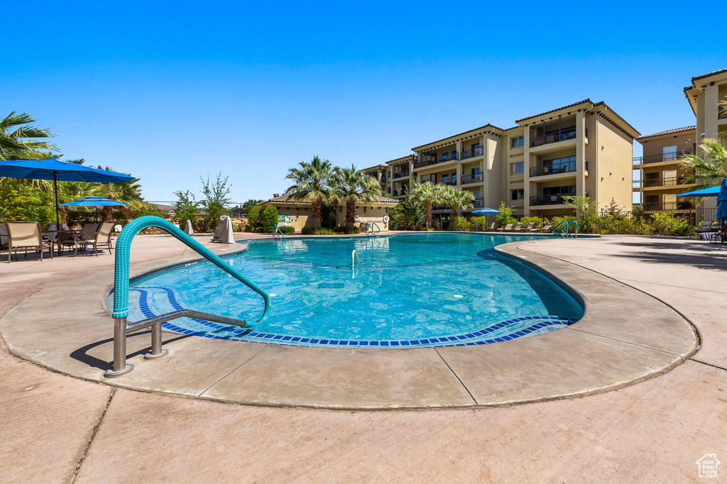 Community pool with a patio area
