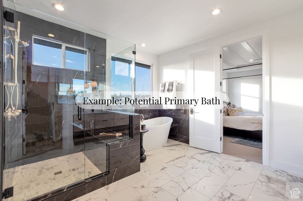 Bathroom featuring a soaking tub, a stall shower, ensuite bath, recessed lighting, and tile walls