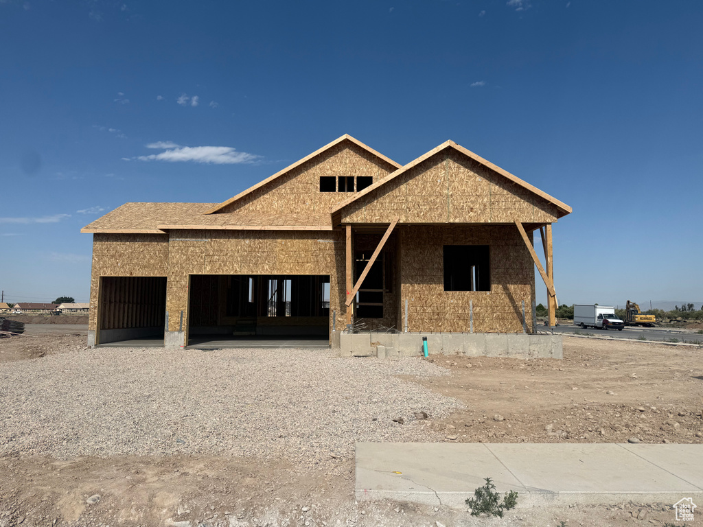 Property in mid-construction featuring an attached garage