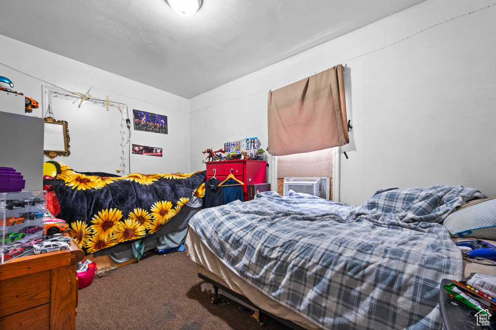 Carpeted bedroom with cooling unit