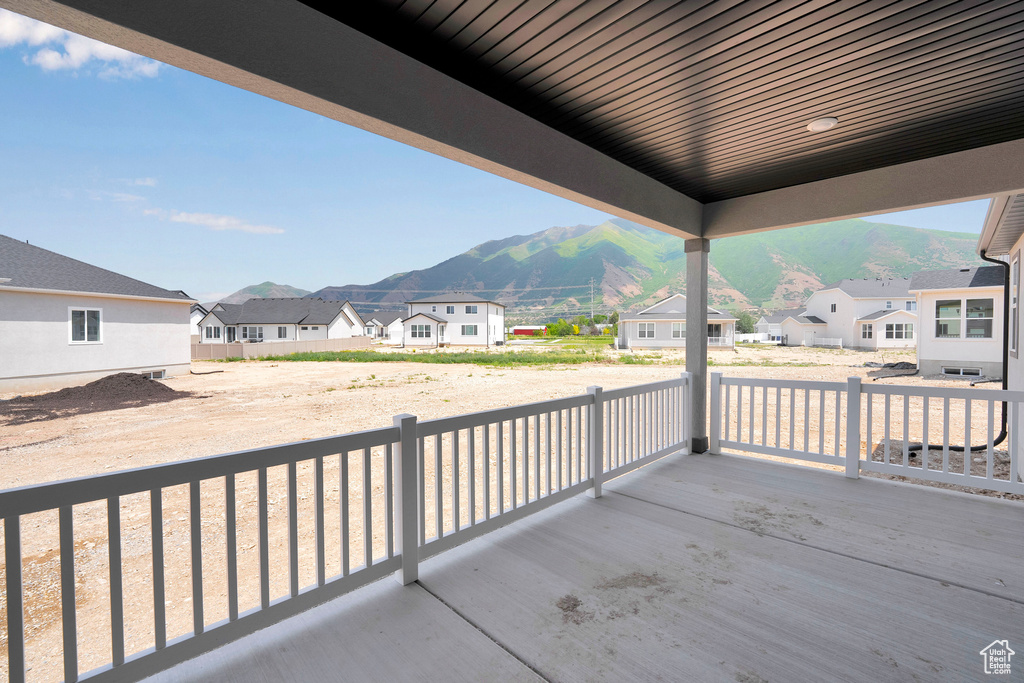 Balcony featuring a mountain view and a residential view