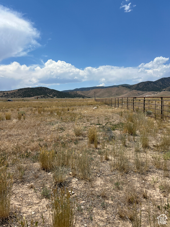 View of mountain background featuring rural landscape
