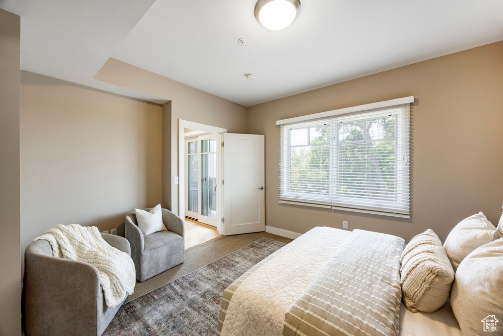 Bedroom featuring access to outside and carpet floors