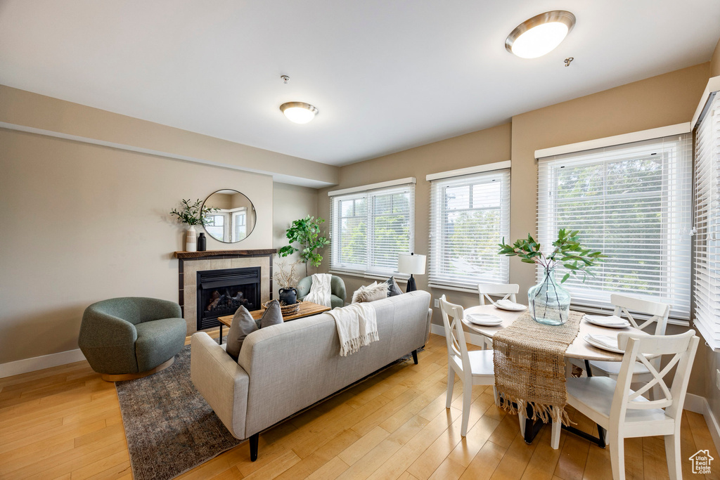 Living area featuring light wood-type flooring and a fireplace