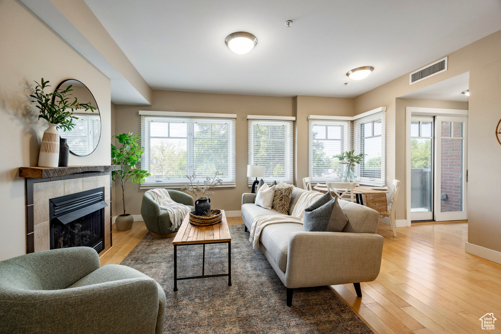 Living room featuring hardwood / wood-style flooring and a fireplace