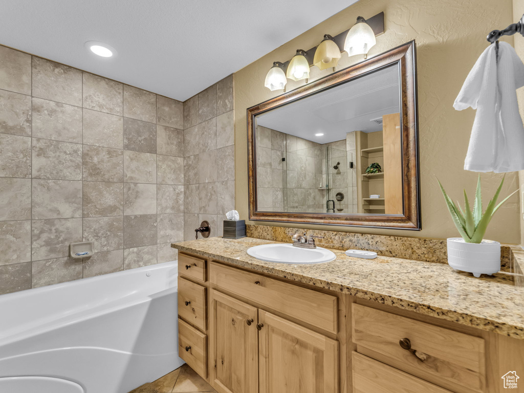 Bathroom with vanity and tile patterned flooring