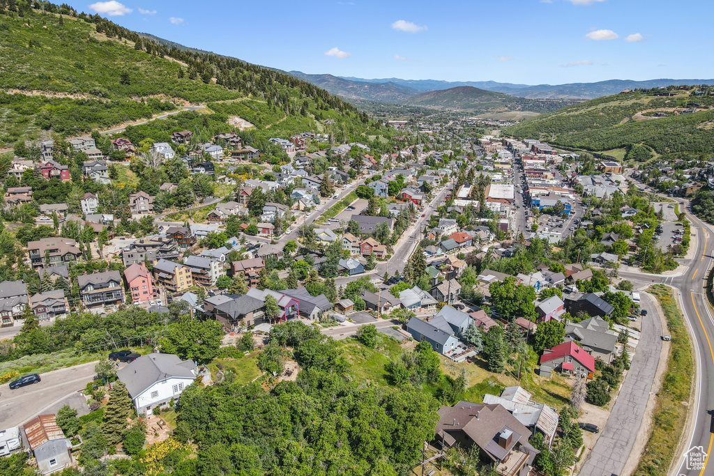 Aerial view of property's location with nearby suburban area