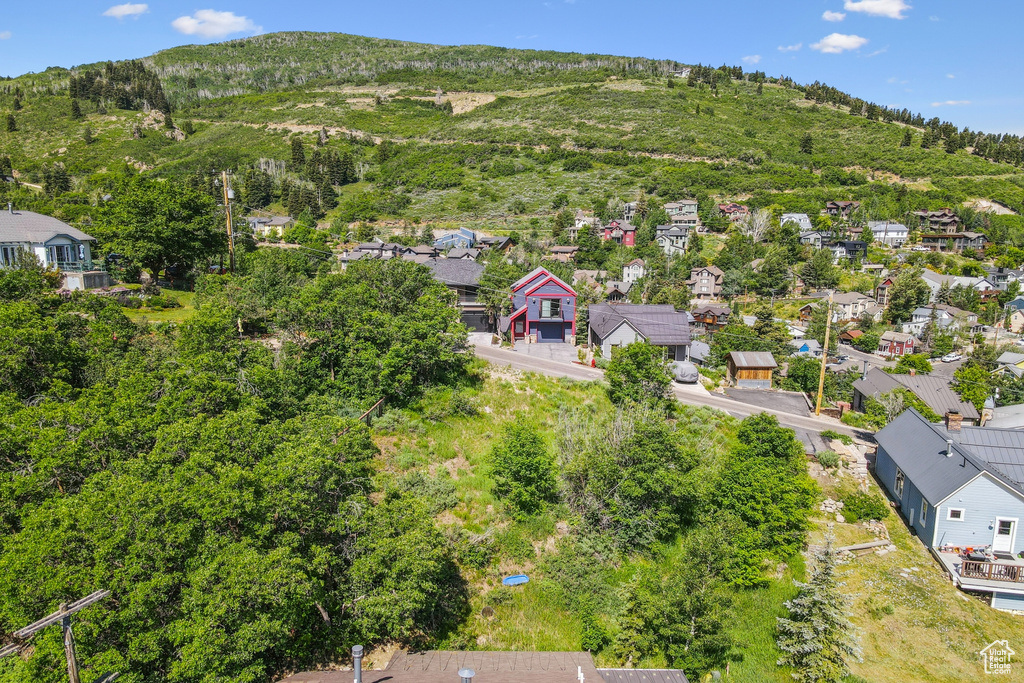 Aerial view of residential area featuring a mountainous background