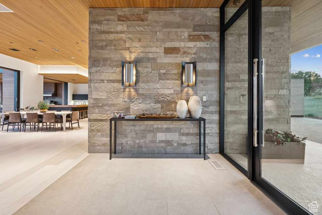 Unfurnished living room featuring wooden ceiling