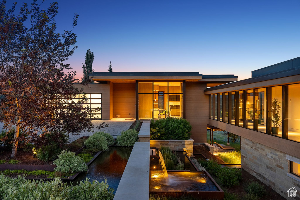 View of exterior entry featuring a garage