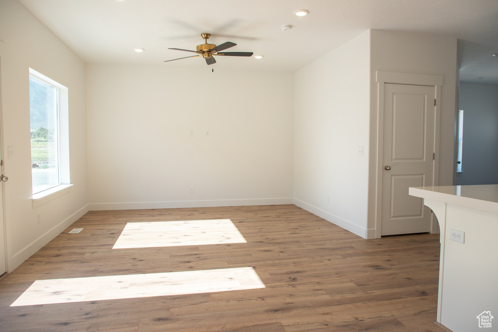 Spare room with recessed lighting, light wood-type flooring, and ceiling fan