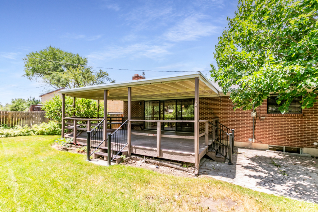 View of yard featuring a wooden deck