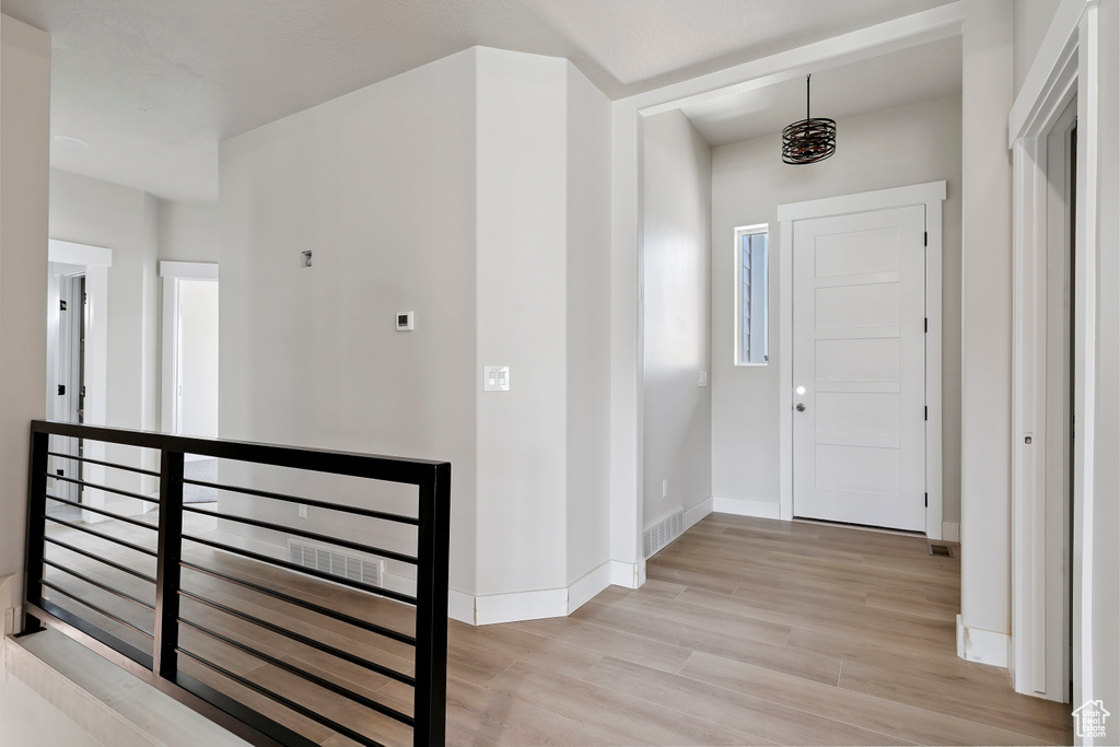 Entryway featuring light wood-style floors and baseboards