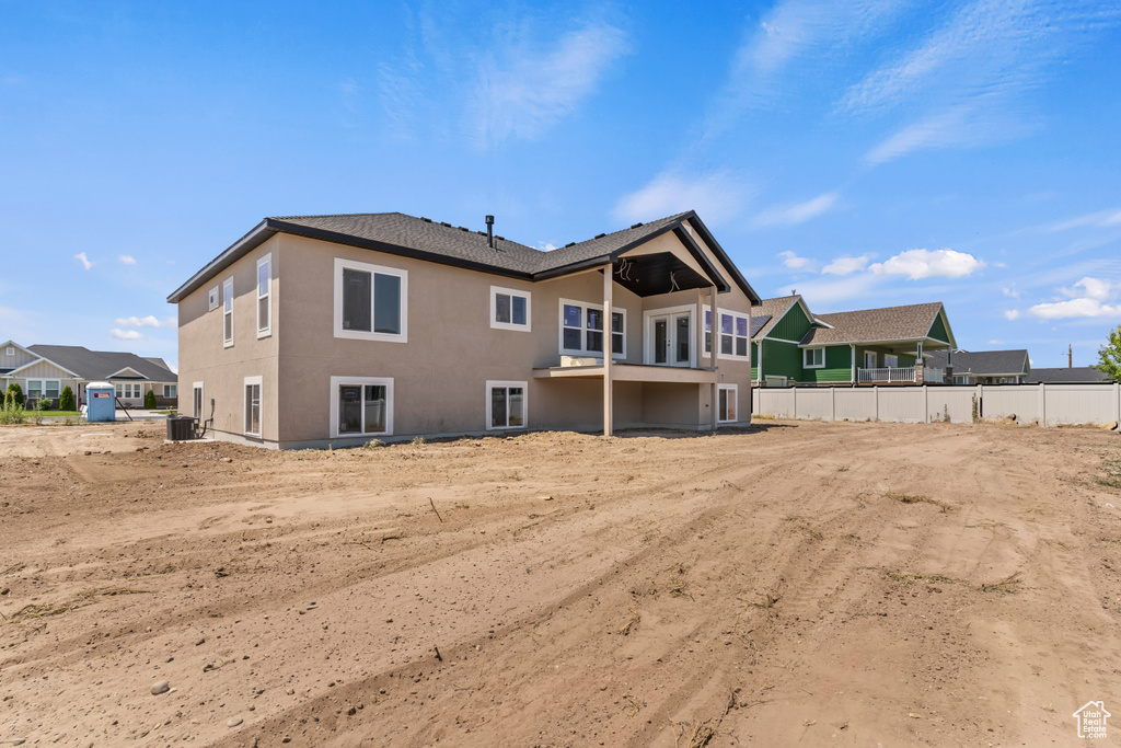 Rear view of house featuring stucco siding