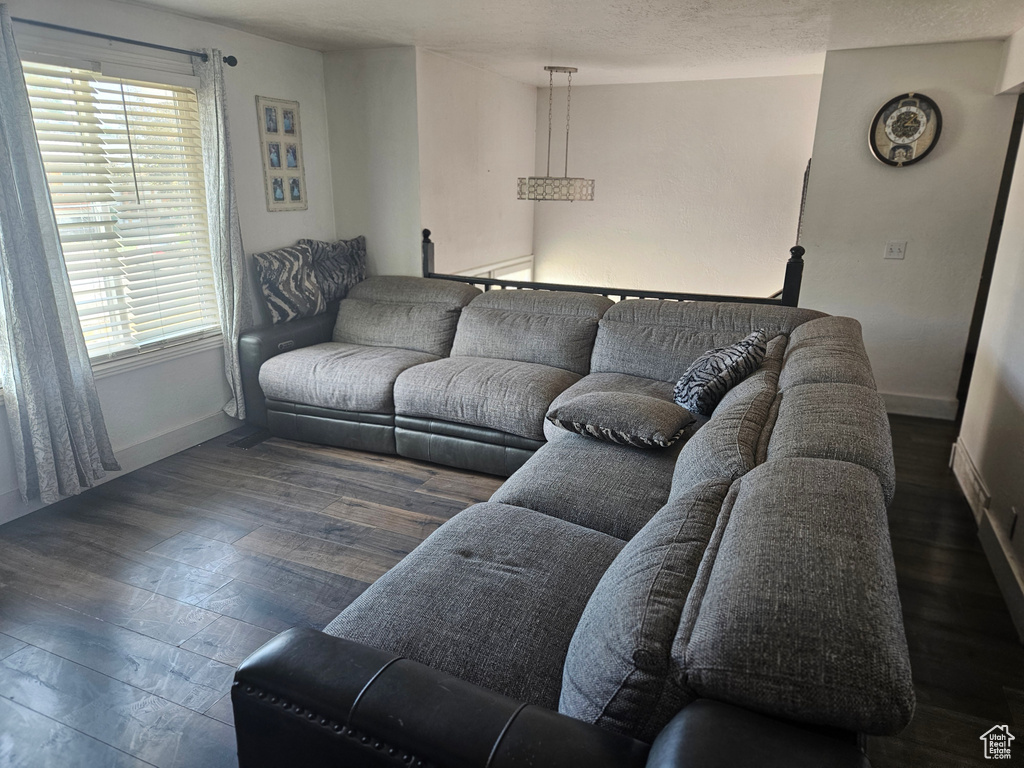 Living area featuring baseboards and wood finished floors