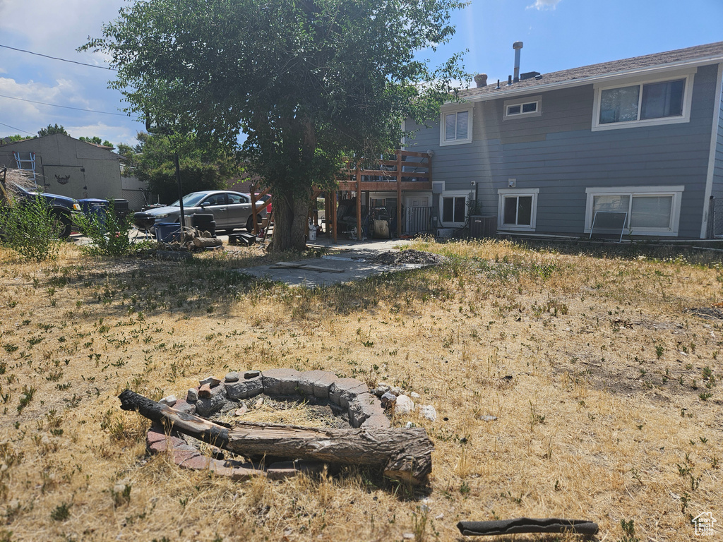 View of yard featuring a wooden deck