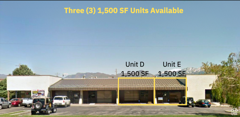 View of property with uncovered parking