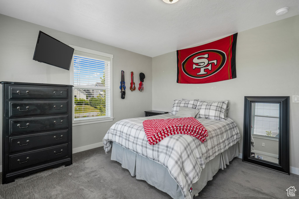 Bedroom featuring carpet flooring