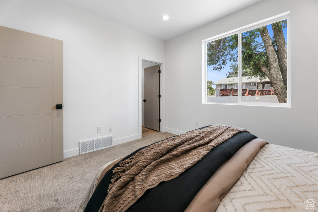 Carpeted bedroom featuring baseboards and recessed lighting
