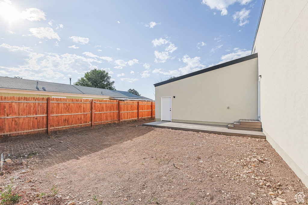 View of fenced backyard