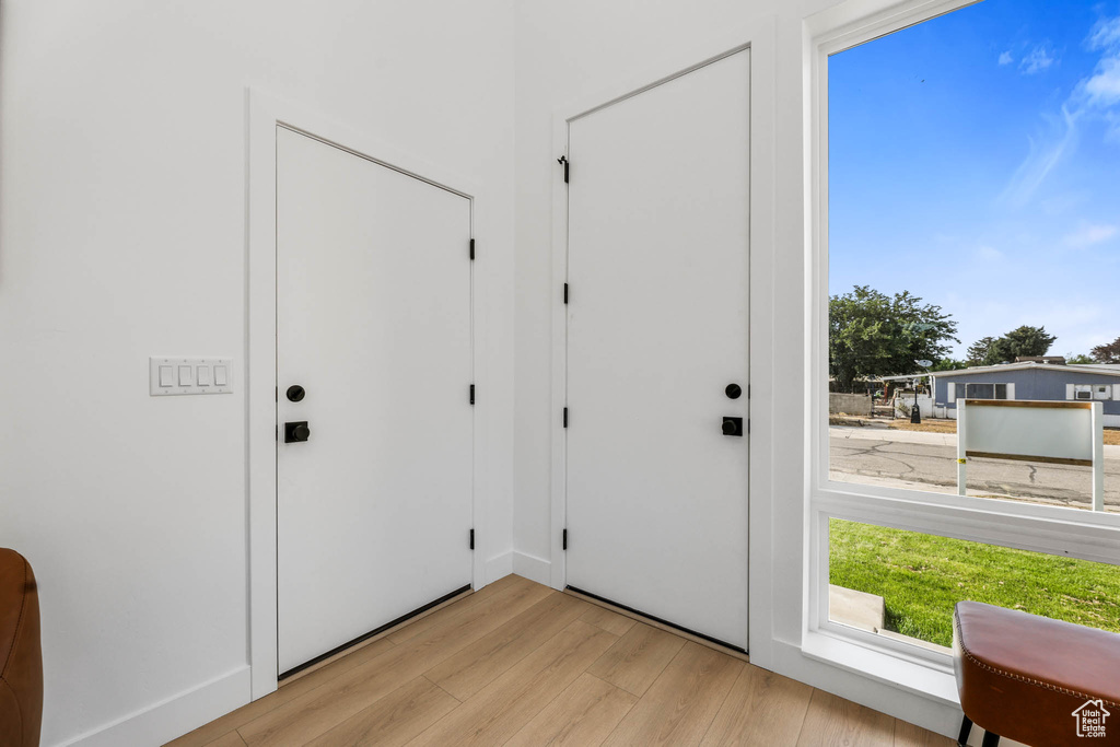 Foyer entrance featuring light wood-style floors