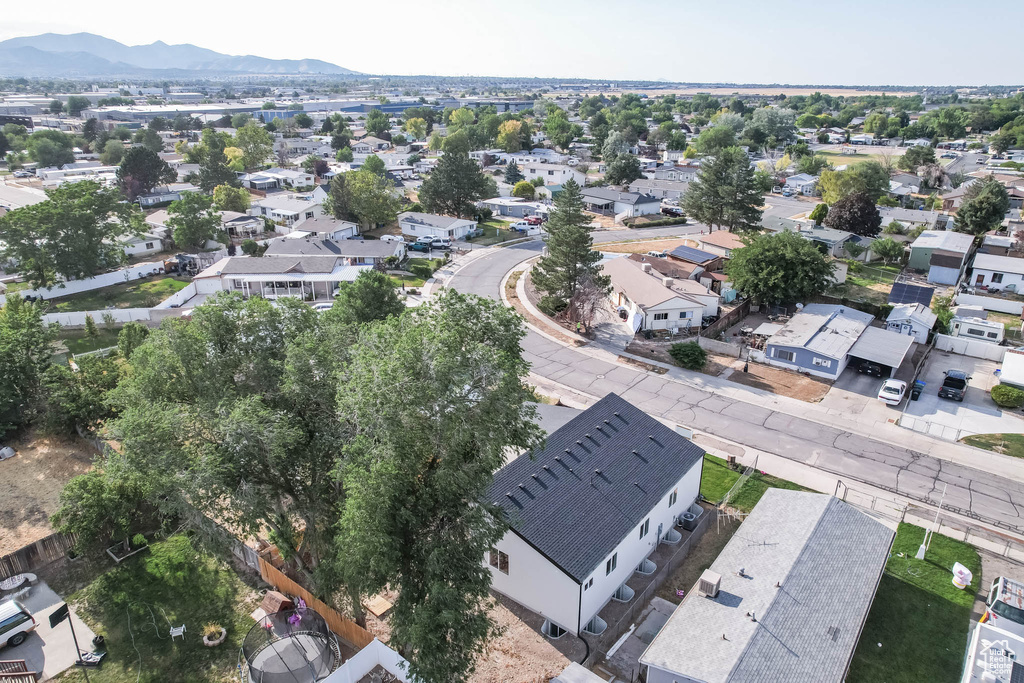 Aerial view of residential area featuring a mountain backdrop