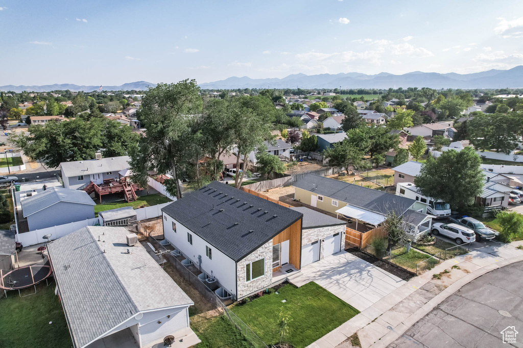 Aerial perspective of suburban area with a mountainous background