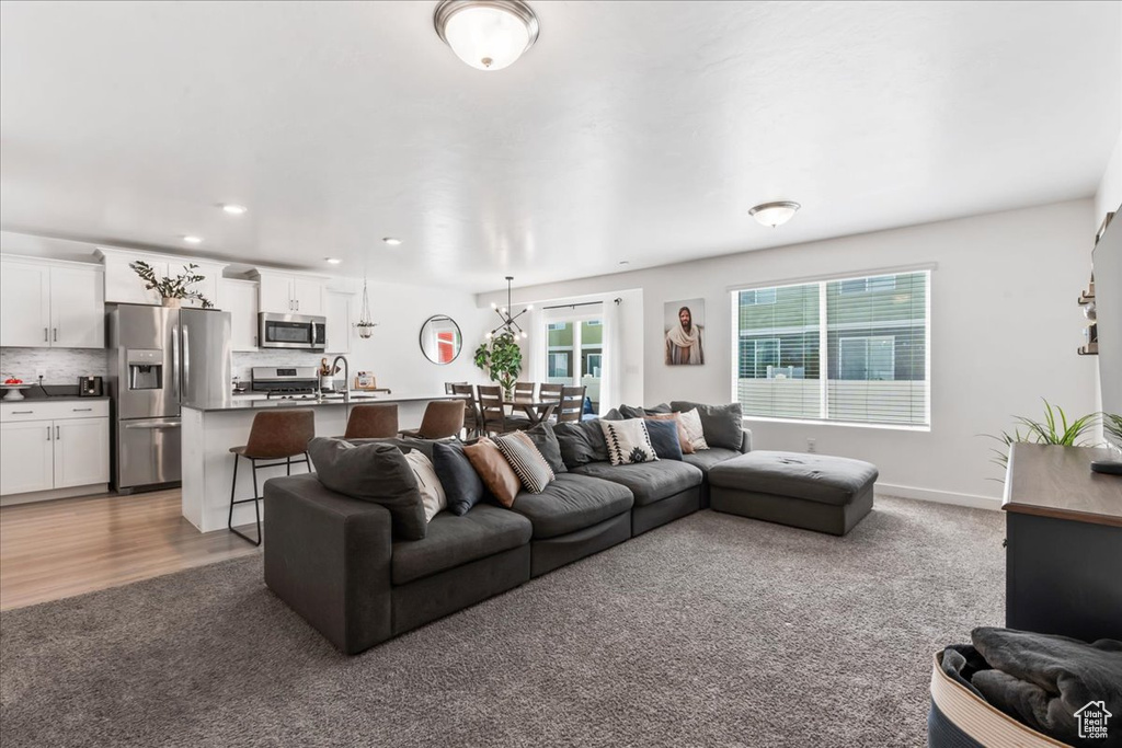 Living area featuring carpet and recessed lighting