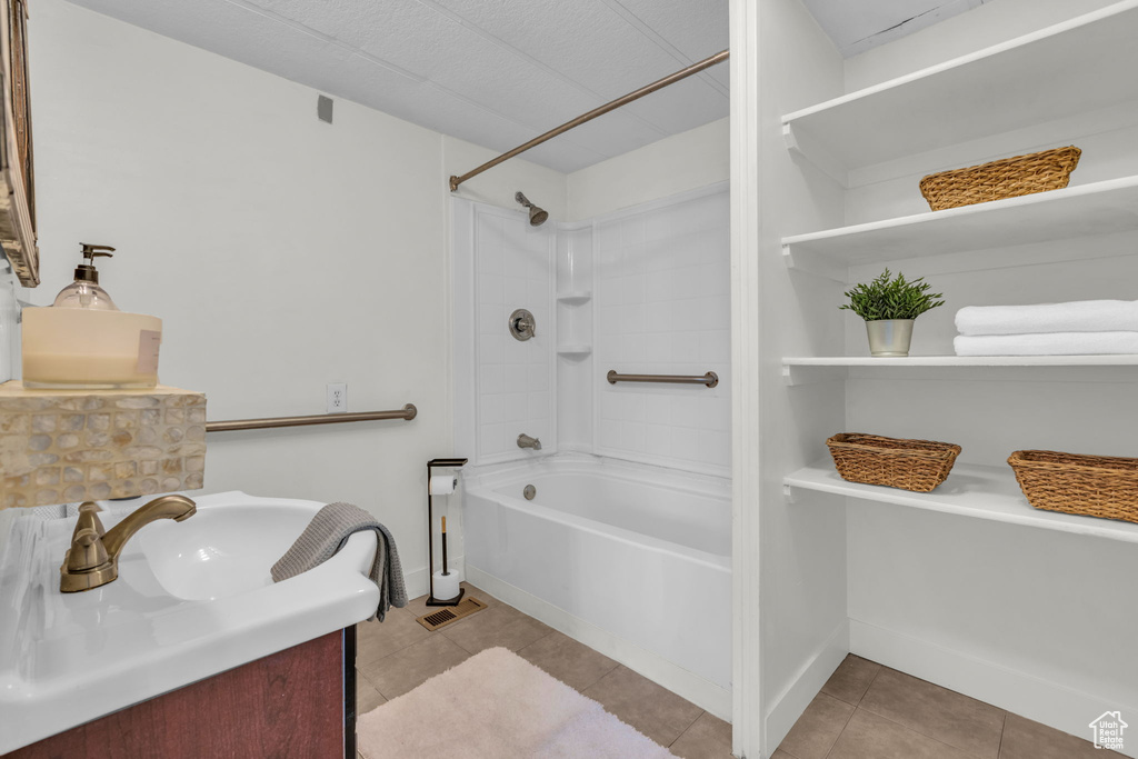 Full bath featuring shower / bath combination, tile patterned floors, and vanity