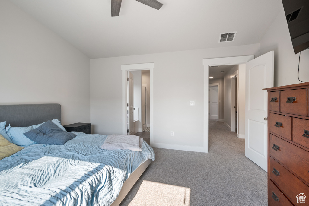Carpeted bedroom with baseboards and ceiling fan