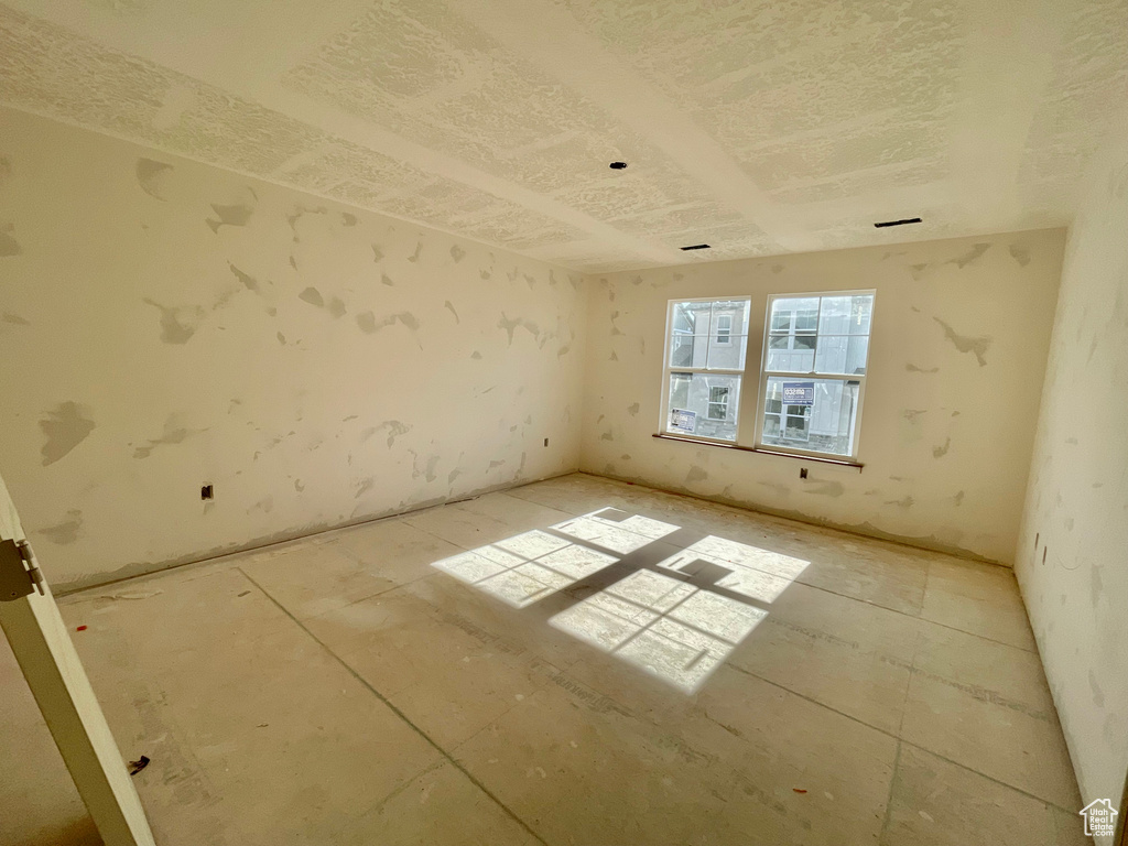 Spare room with a textured ceiling