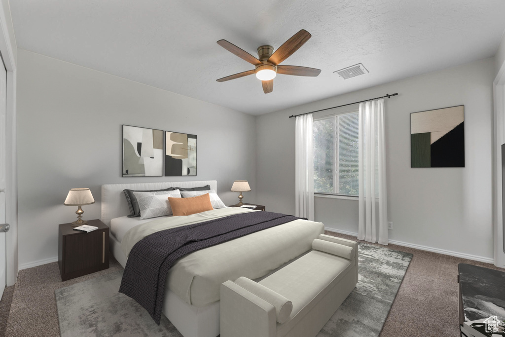 Carpeted bedroom with baseboards and a ceiling fan