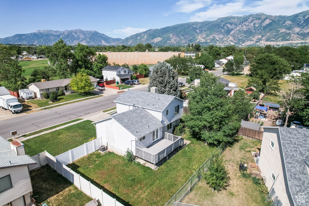 Aerial perspective of suburban area with a mountain backdrop