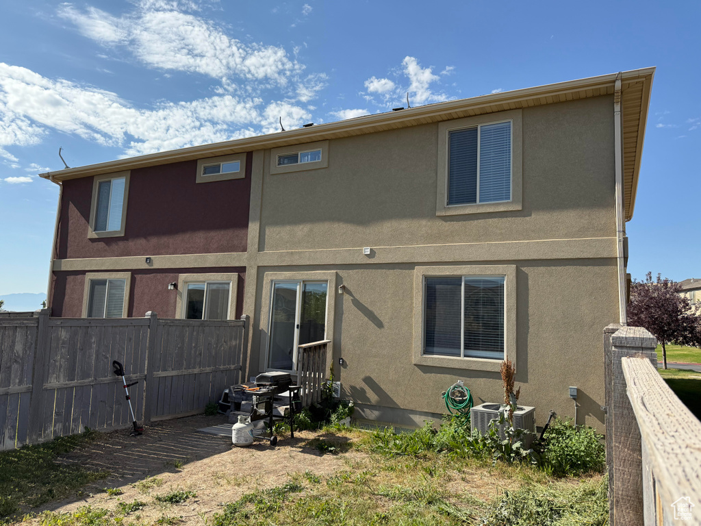 Back of house with stucco siding