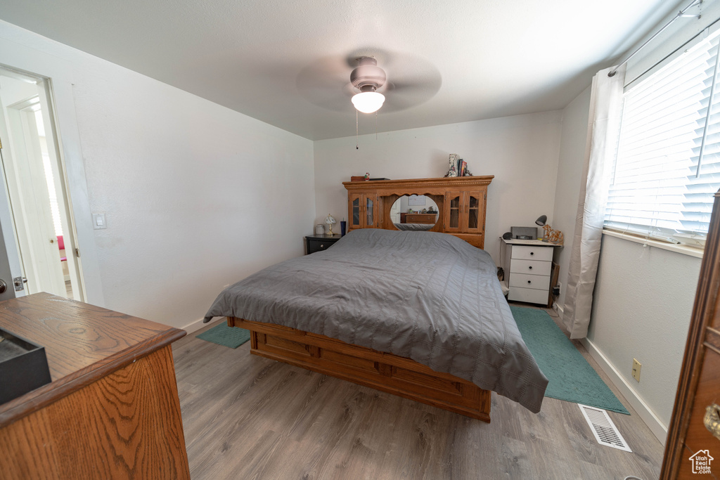 Bedroom featuring light wood finished floors and a ceiling fan