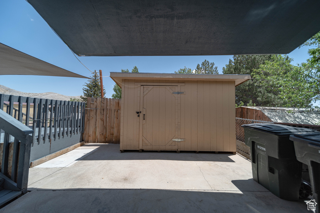 View of patio / terrace featuring a shed